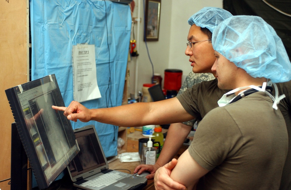 U.S. medical personnel discuss an x-ray.