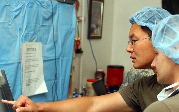 U.S. medical personnel discuss an x-ray.