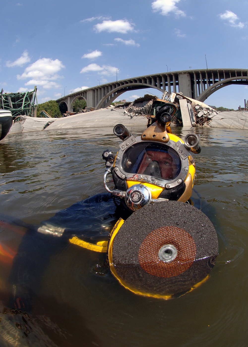 Petty Officer 1st Class Joshua Harsh prepares to submerge on a salvage dive.