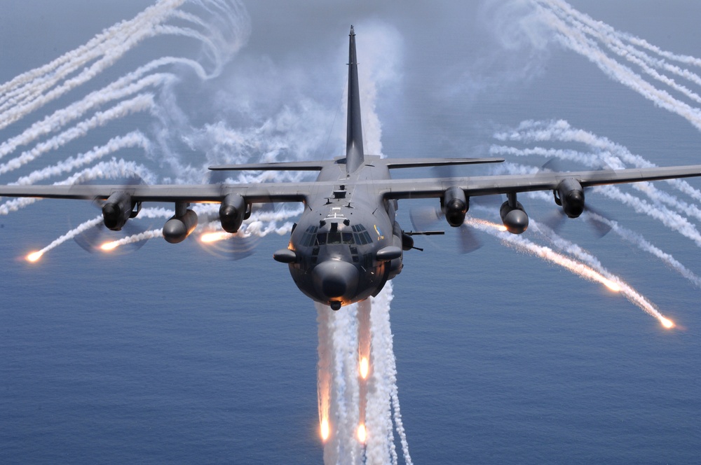 A U.S. Air Force AC-130H Spectre gunship jettisons flares.