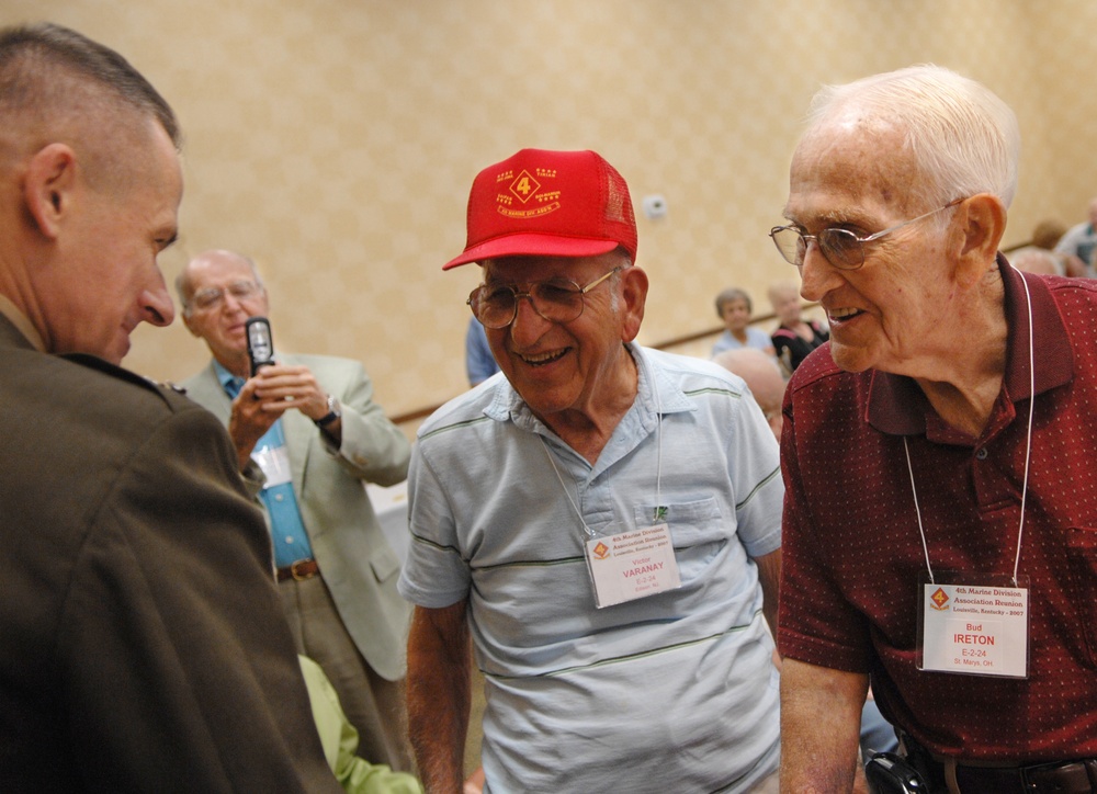 Gen. Peter Pace talks with two World War II Marine veterans.