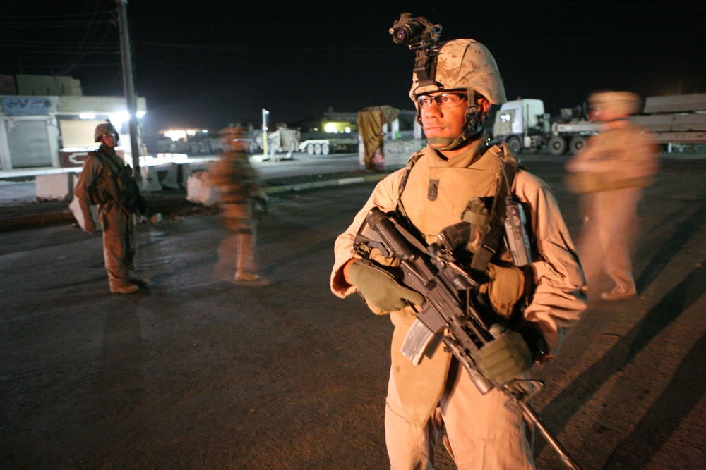 A U.S. Marine provides security for fellow Marines.