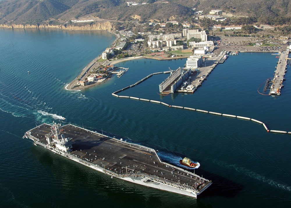 The USS Nimitz (CVN 68) passes Naval Base Point Loma.