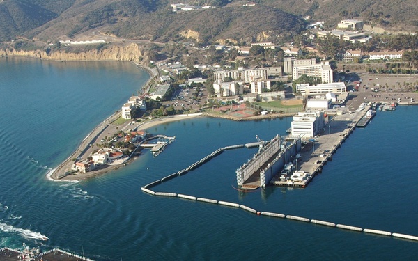 The USS Nimitz (CVN 68) passes Naval Base Point Loma.