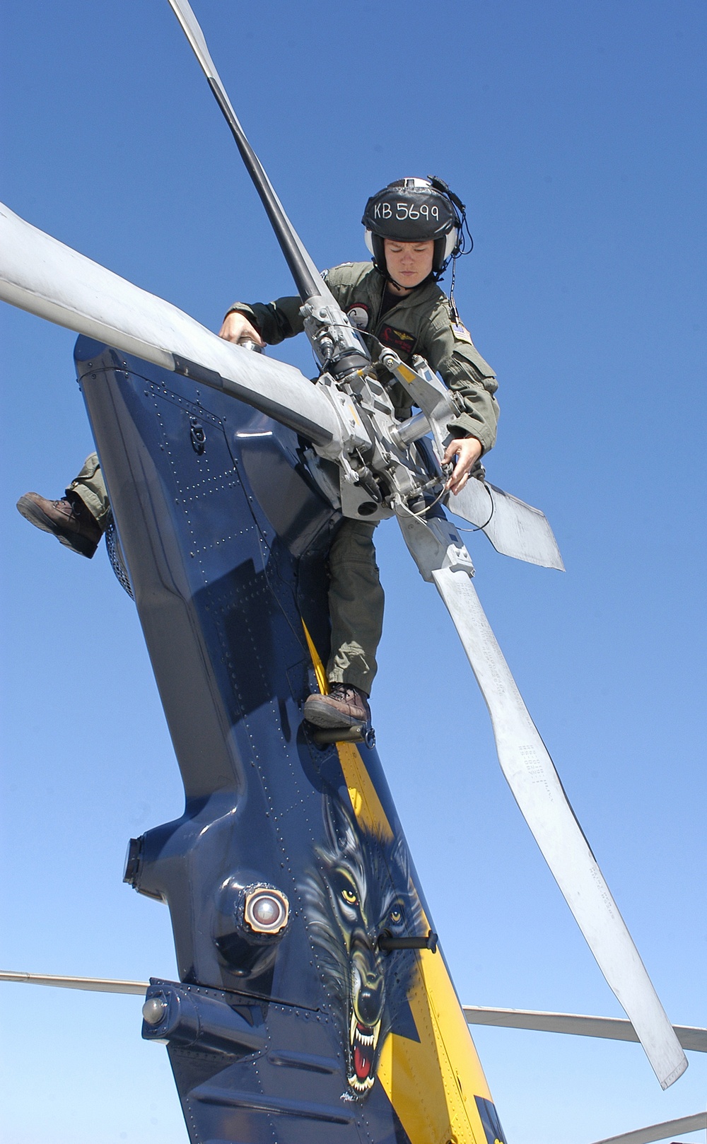 Lt. Kathryn Baehr performs a pre-flight inspection on an SH-60B Seahawk helicopter.
