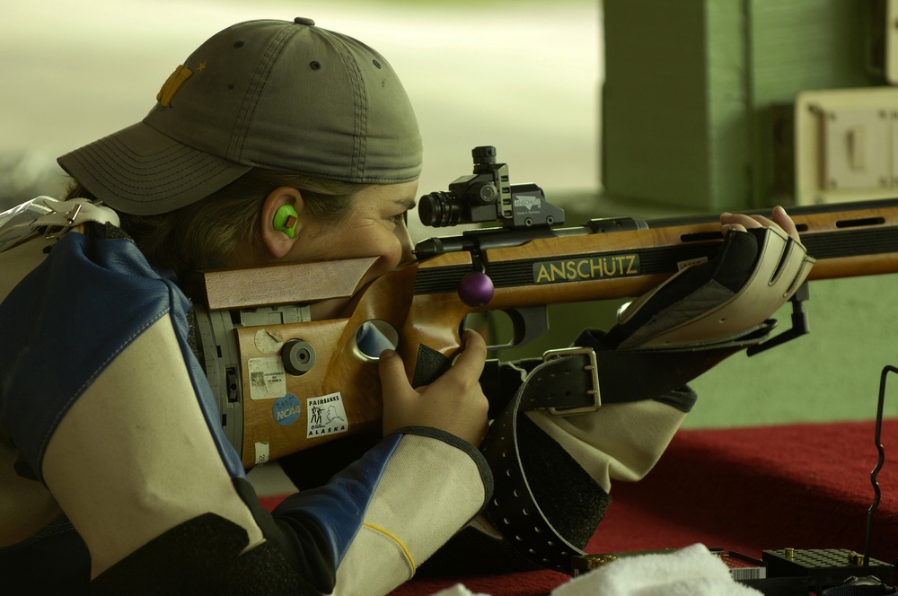 Ensign Sara Bergman competes in the women's team 50-meter prone rifle competition.