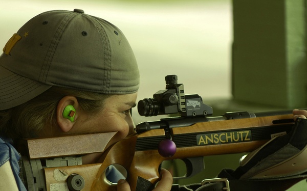 Ensign Sara Bergman competes in the women's team 50-meter prone rifle competition.