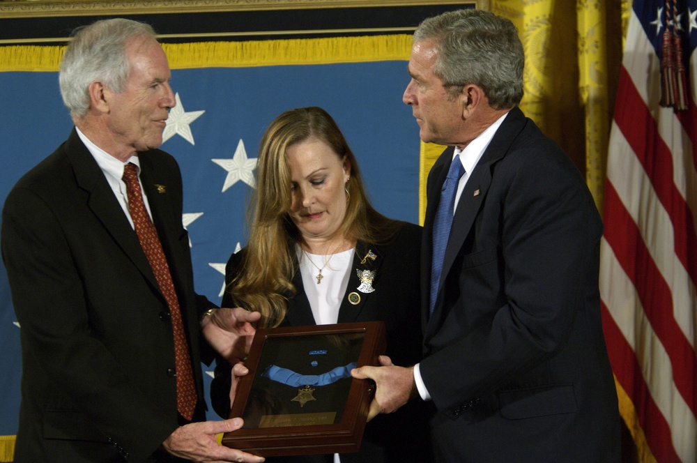 President George W. Bush presents the Medal of Honor to Daniel and Maureen Murphy.