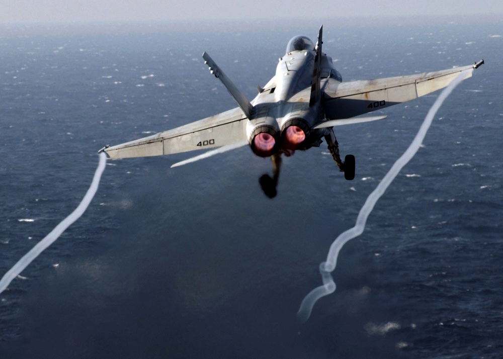 A U.S. Navy F/A-18 Super Hornet launches from the aircraft carrier USS Theodore Roosevelt.