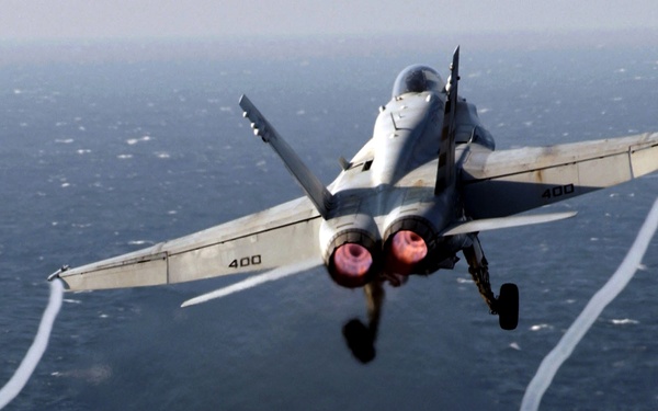 A U.S. Navy F/A-18 Super Hornet launches from the aircraft carrier USS Theodore Roosevelt.