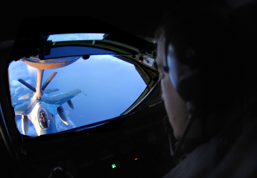 Staff Sgt. Daniel Maas carefully operates the boom of a KC-135 Stratotanker.