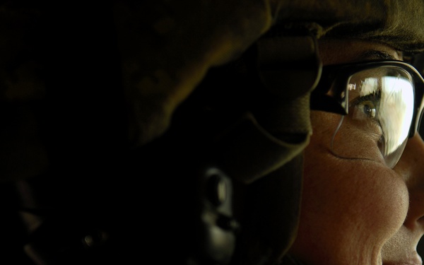 Airman 1st Class Brittany Ward waits in her tactical vehicle.