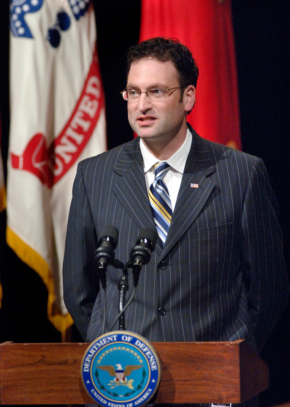 Portrait photographer David DeJonge addresses the audience during Pentagon ceremonies.