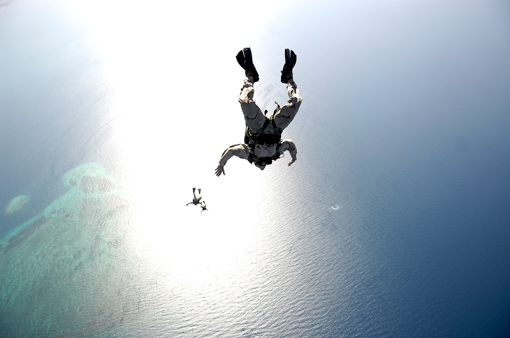 U.S. Air Force pararescuemen conduct a pararescue training jump.