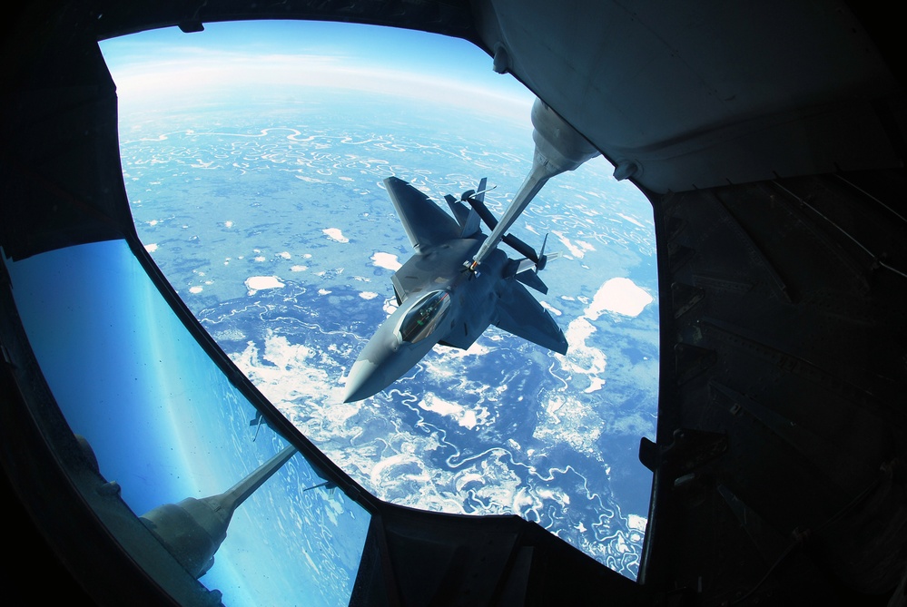 An Air Force F-22 Raptor aircraft takes on fuel.