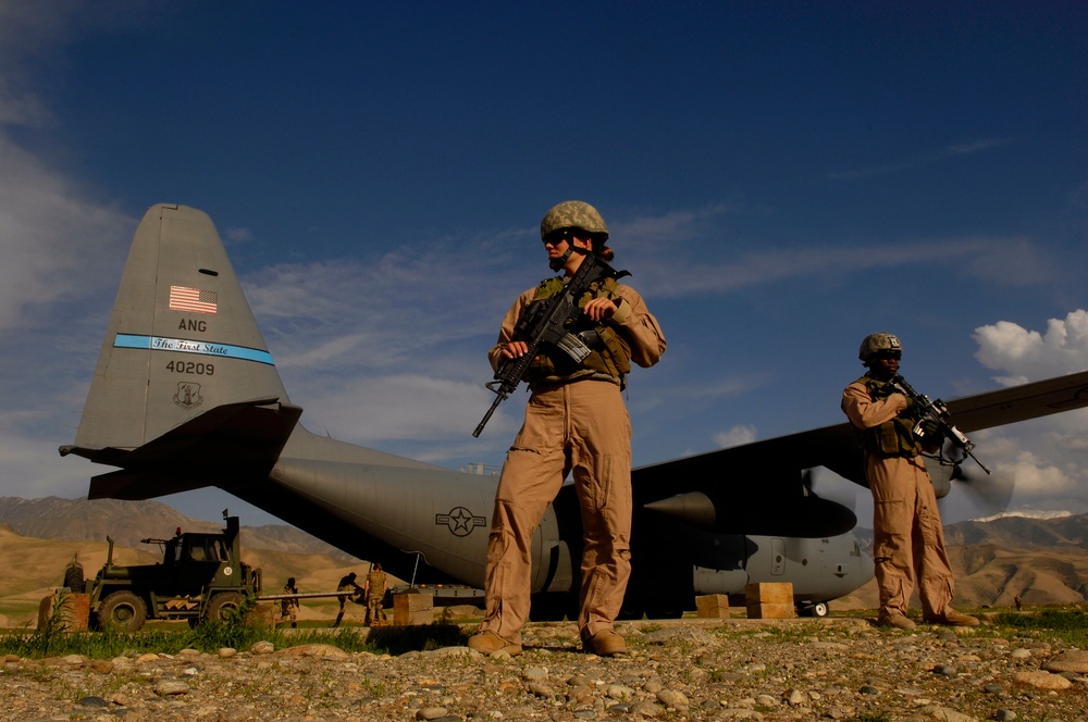 Airman 1st Class Kelliea Guthrie and Senior Airman Greg Ellis provide security.