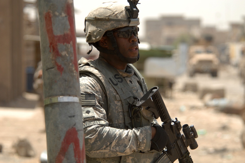 Spc. Marcus Wright provides security during a patrol.