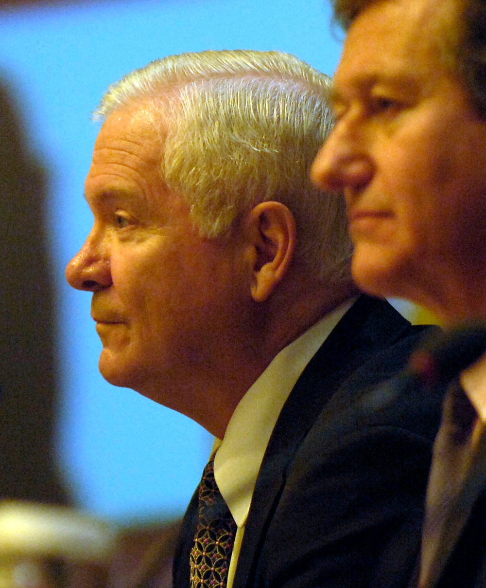 Secretary Gates and John Chipman listen to a question.
