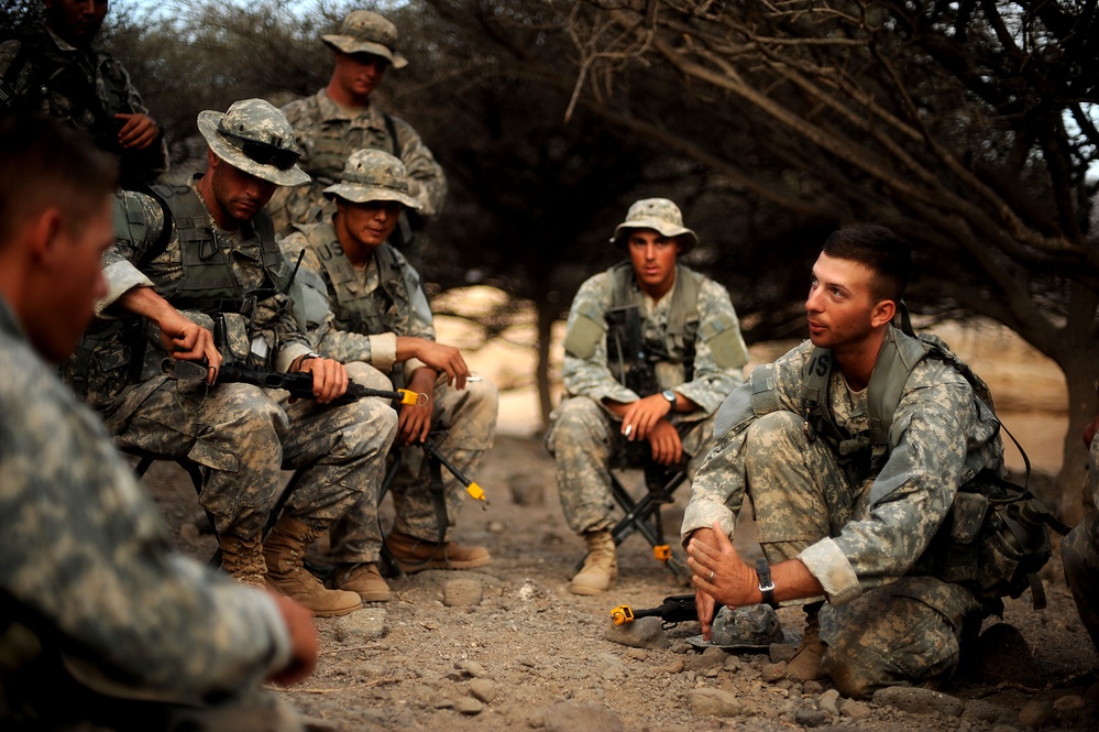 Staff Sgt. Matthew Tardio briefs his squad on tactical movements.