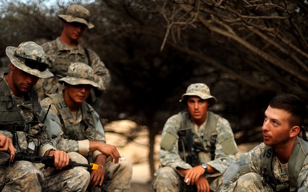 Staff Sgt. Matthew Tardio briefs his squad on tactical movements.