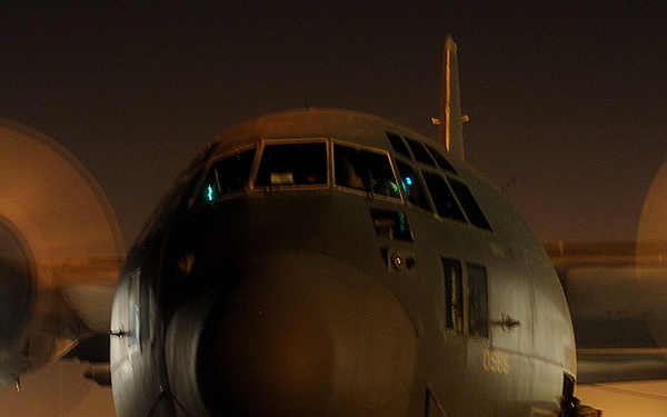 A U.S. Army soldier boards an HC-130 Hercules aircraft.