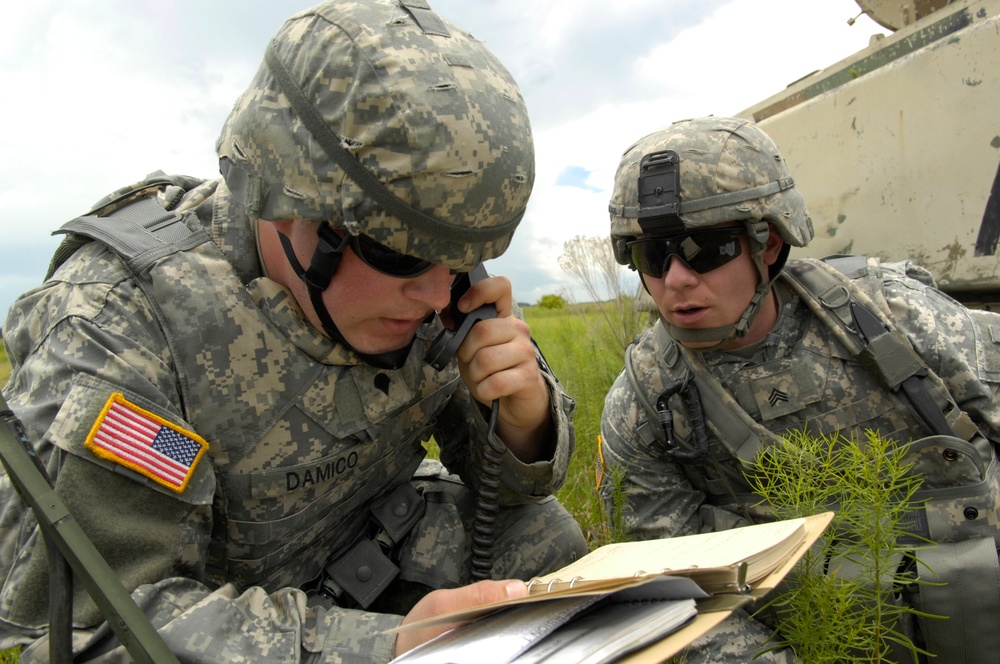 Spc. James D'Amico and Sgt. Timothy Boggs call for support from air assets.