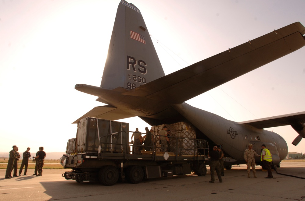 A U.S. Air Force C-130 Hercules aircraft delivers humanitarian aid.