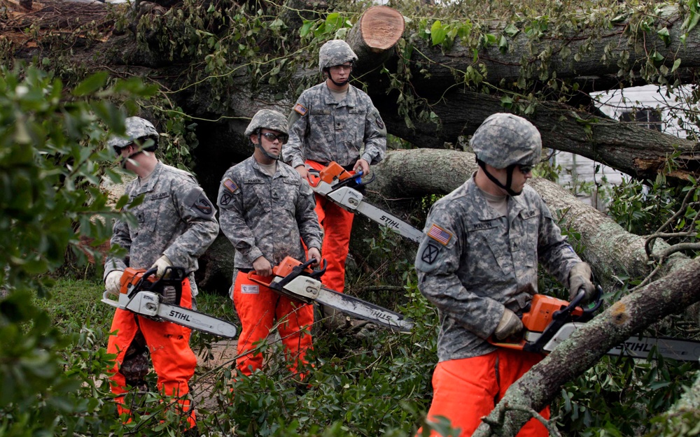 U.S. Army soldiers return to clear roads.