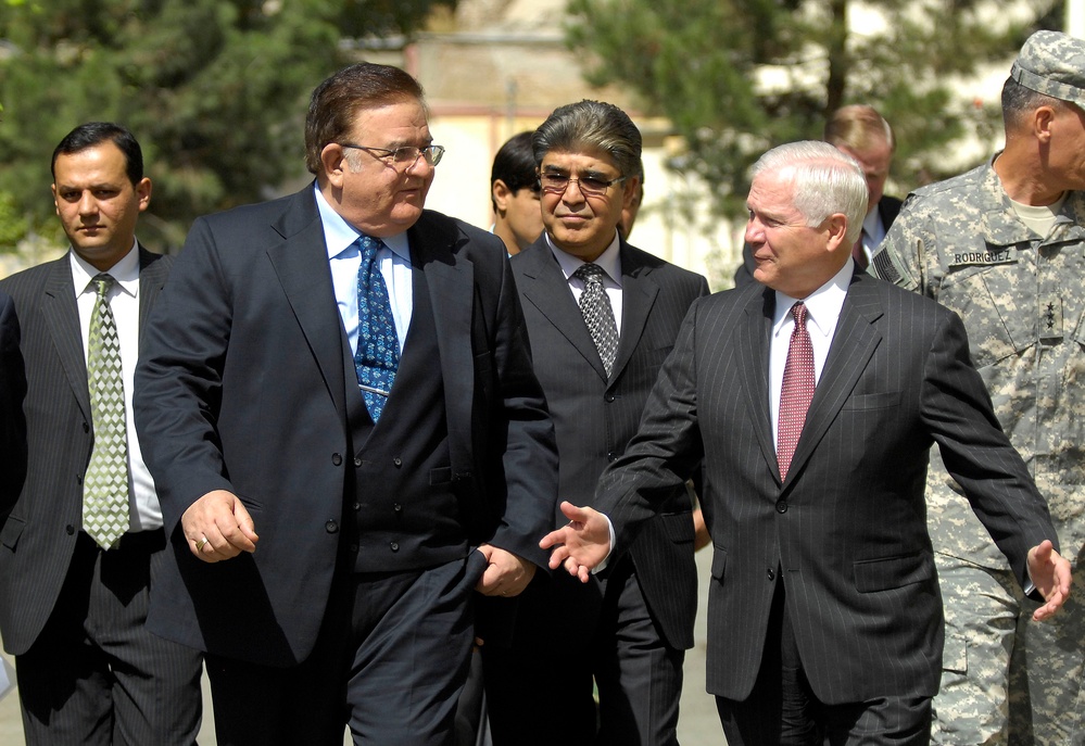 Secretary Gates walks and converses with Afghan Defense Minister Abdul Rahim Wardak.