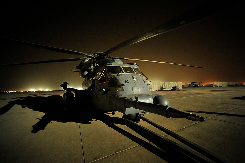 A U.S. Air Force MH-53 Pave Low helicopter sits on the tarmac.