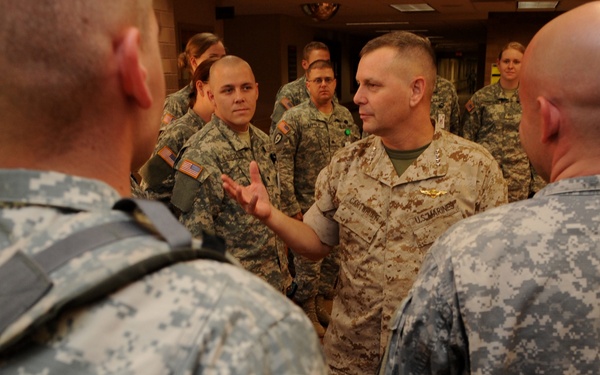 Gen. James E. Cartwright speaks with U.S. service members.
