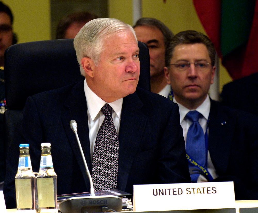 Secretary Gates listens to opening remarks.