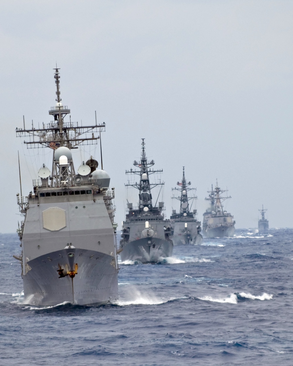 The USS Shiloh (CG 67) leads a formation of U.S. Navy and Japanese Maritime Self-Defense Force ships.