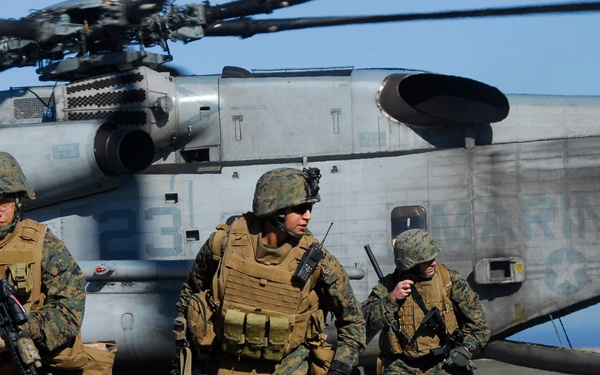 U.S. Marines run towards their security positions.