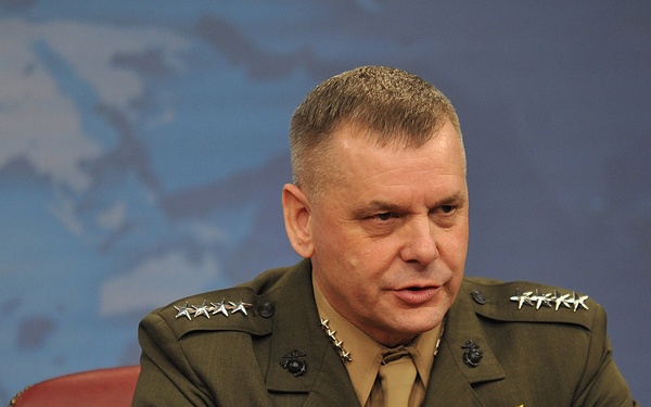 Gen. James E. Cartwright speaks with members of the press.