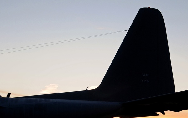 A U.S. Air Force airman inspects a C-130 Hercules aircraft.