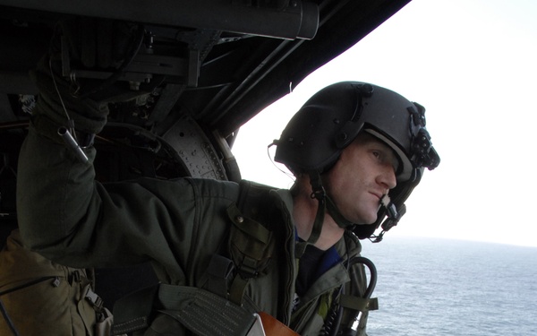 Staff Sgt. Joseph Kenney observes his surroundings for flight safety.