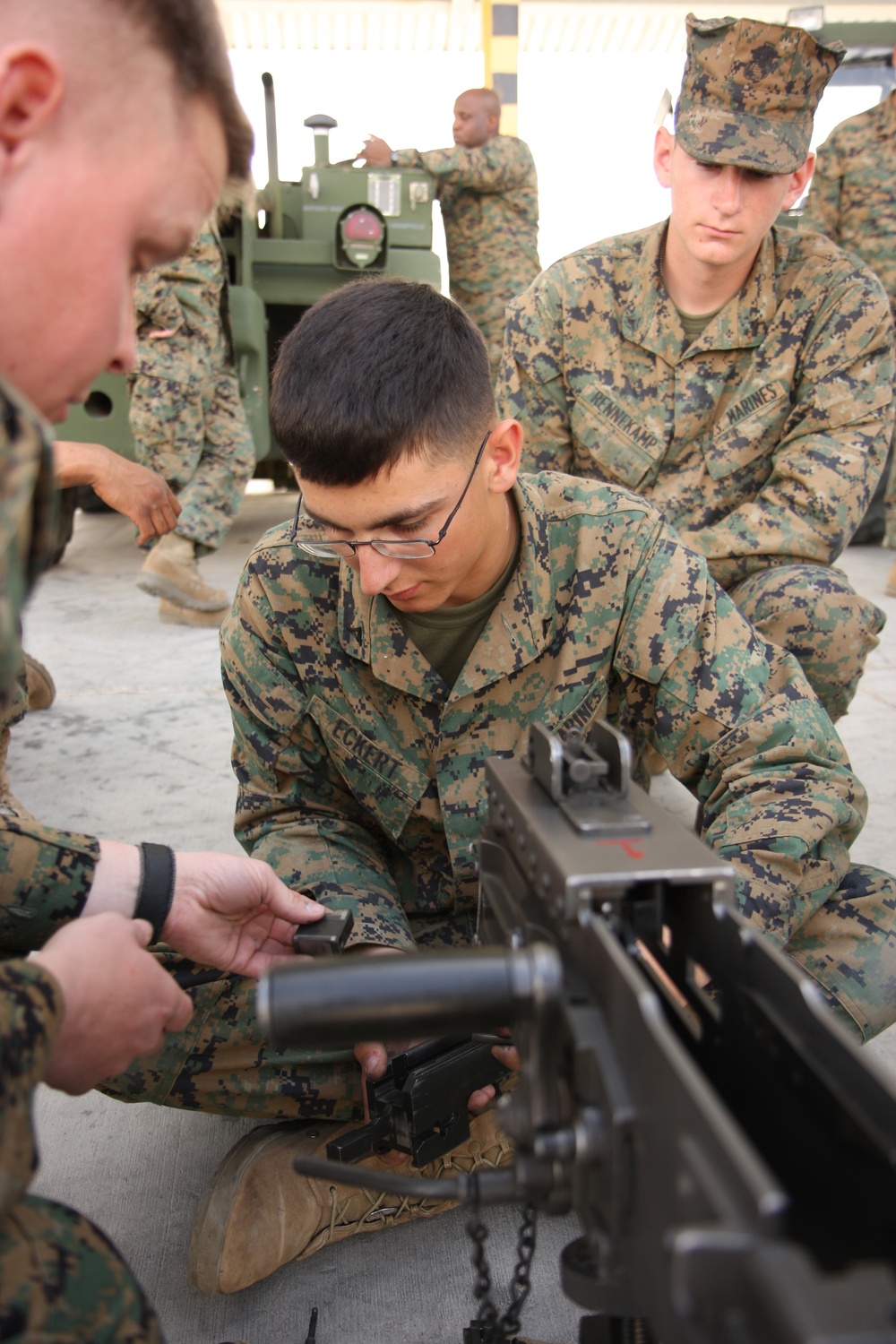 Lance Cpl. Johnathan Eckart assembles an M2 .50 caliber machine gun.