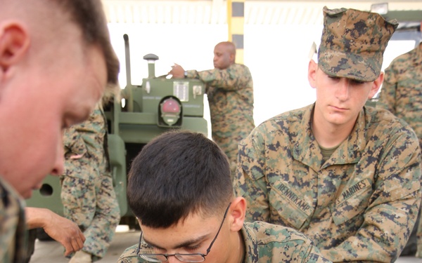 Lance Cpl. Johnathan Eckart assembles an M2 .50 caliber machine gun.