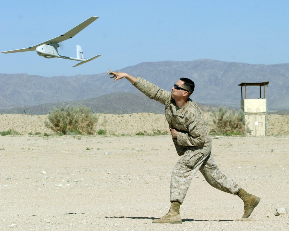 Lt. Ben Ortiz launches an RQ-11 Raven B unmanned aerial vehicle.