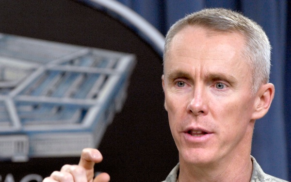 Col. Thomas E. O'Donovan briefs reporters.