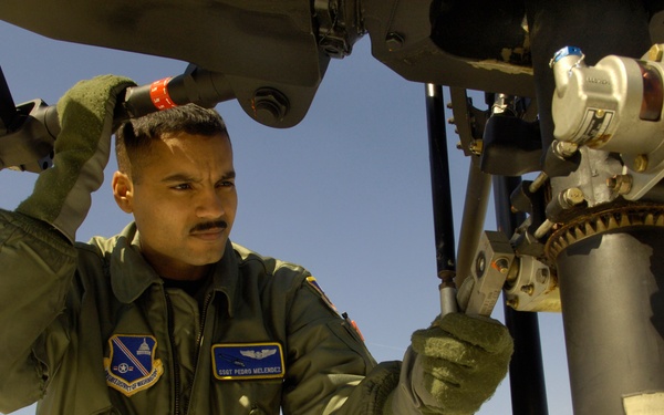 Staff Sgt. Pedro Melendez performs preflight checks.