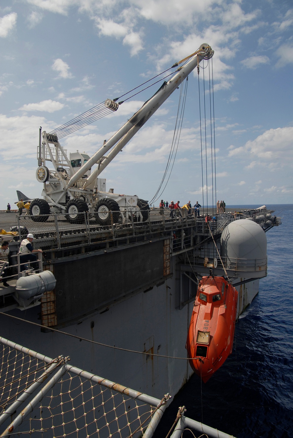 The lifeboat from the Maersk Alabama is hoisted aboard the USS Boxer (LHD 4).