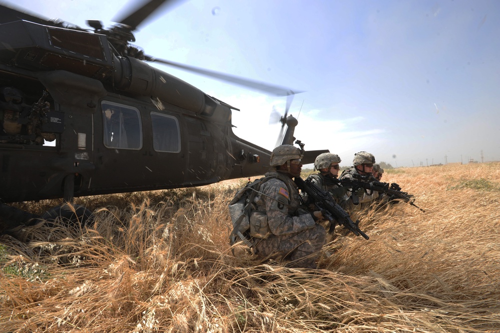 U.S. Army soldiers set up security after exiting a UH-60 Blackhawk helicopter.