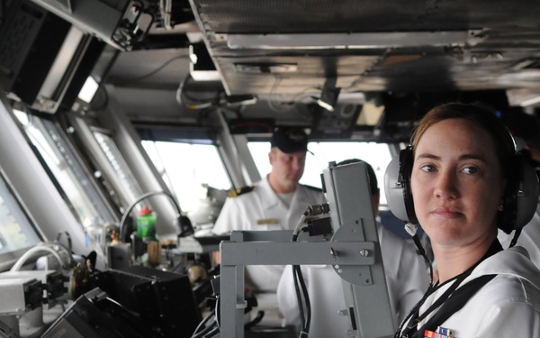 Petty Officer 2nd Class Debra Snide stands watch in the pilot house.