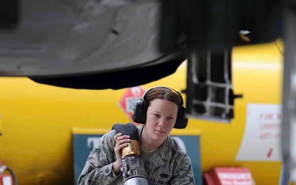 Airman 1st Class Tara Isbell prepares to refuel an F-15 Strike Eagle.