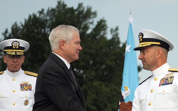 Secretary Gates congratulates incoming European Command Commander Adm. James Stavridis.