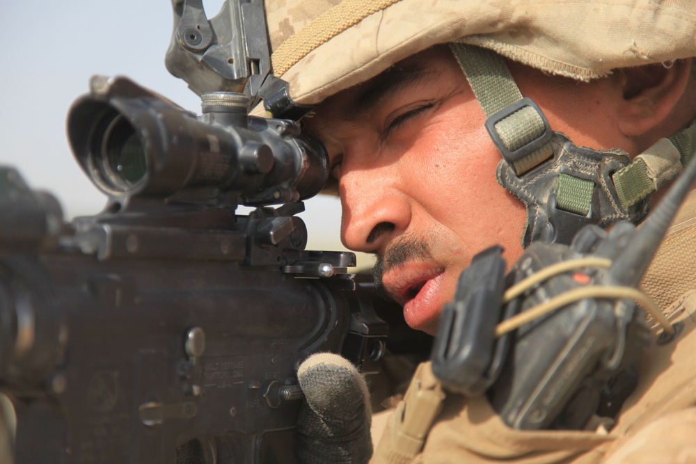 Sgt. Raphi Mercado scans the area outside Fire Base Fiddler's Green.