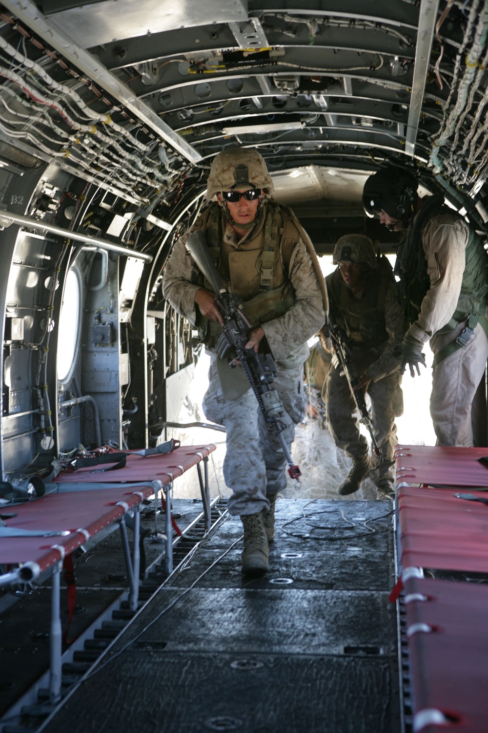 U.S. Marines board a CH-46 Sea Knight helicopter.