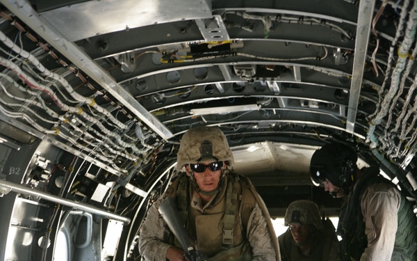 U.S. Marines board a CH-46 Sea Knight helicopter.